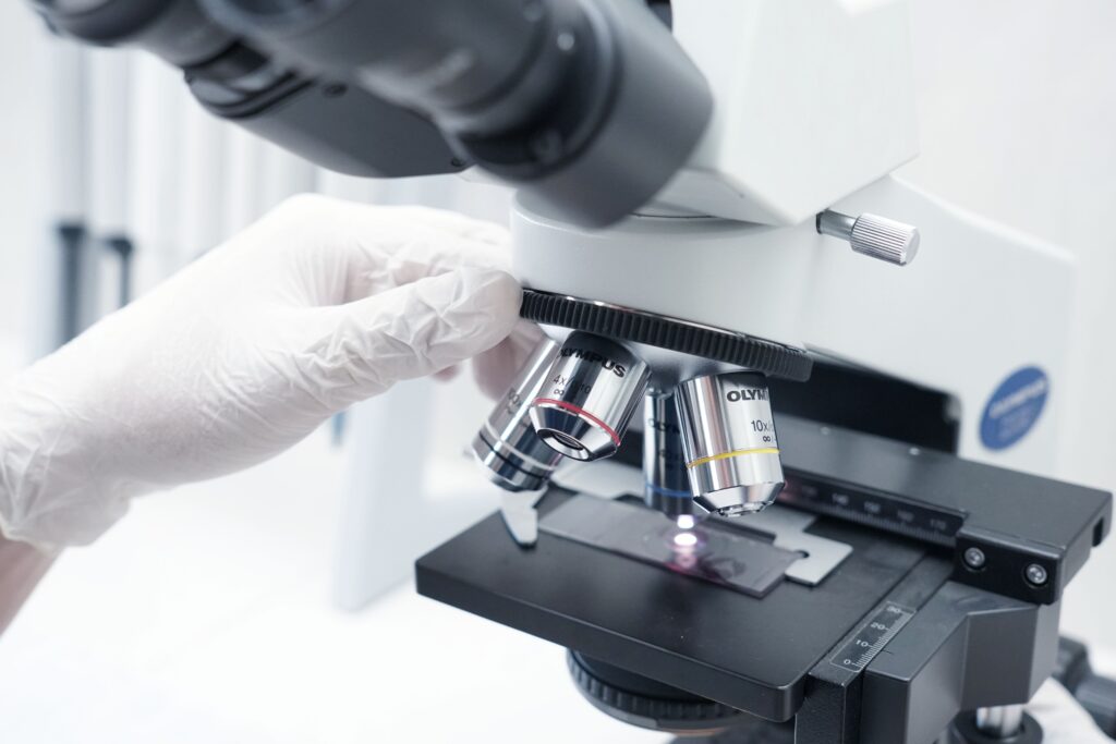 A detailed view of a microscope being used in a modern laboratory.